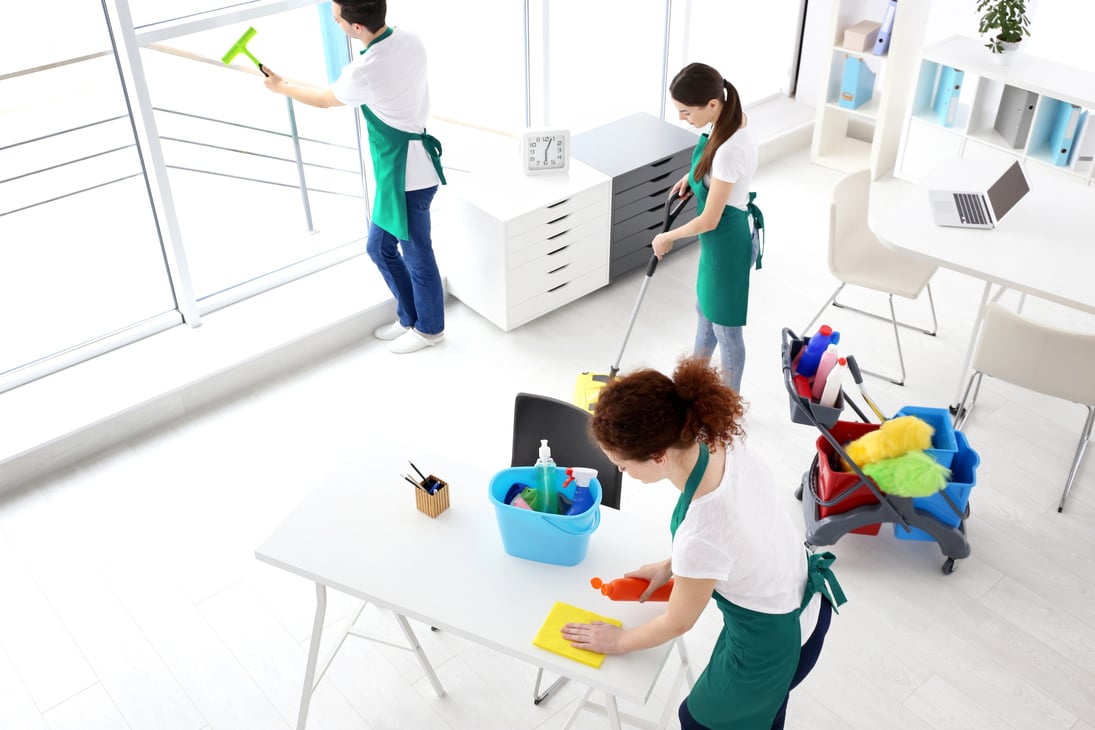 A Cleaning Service Team Cleaning an Office 